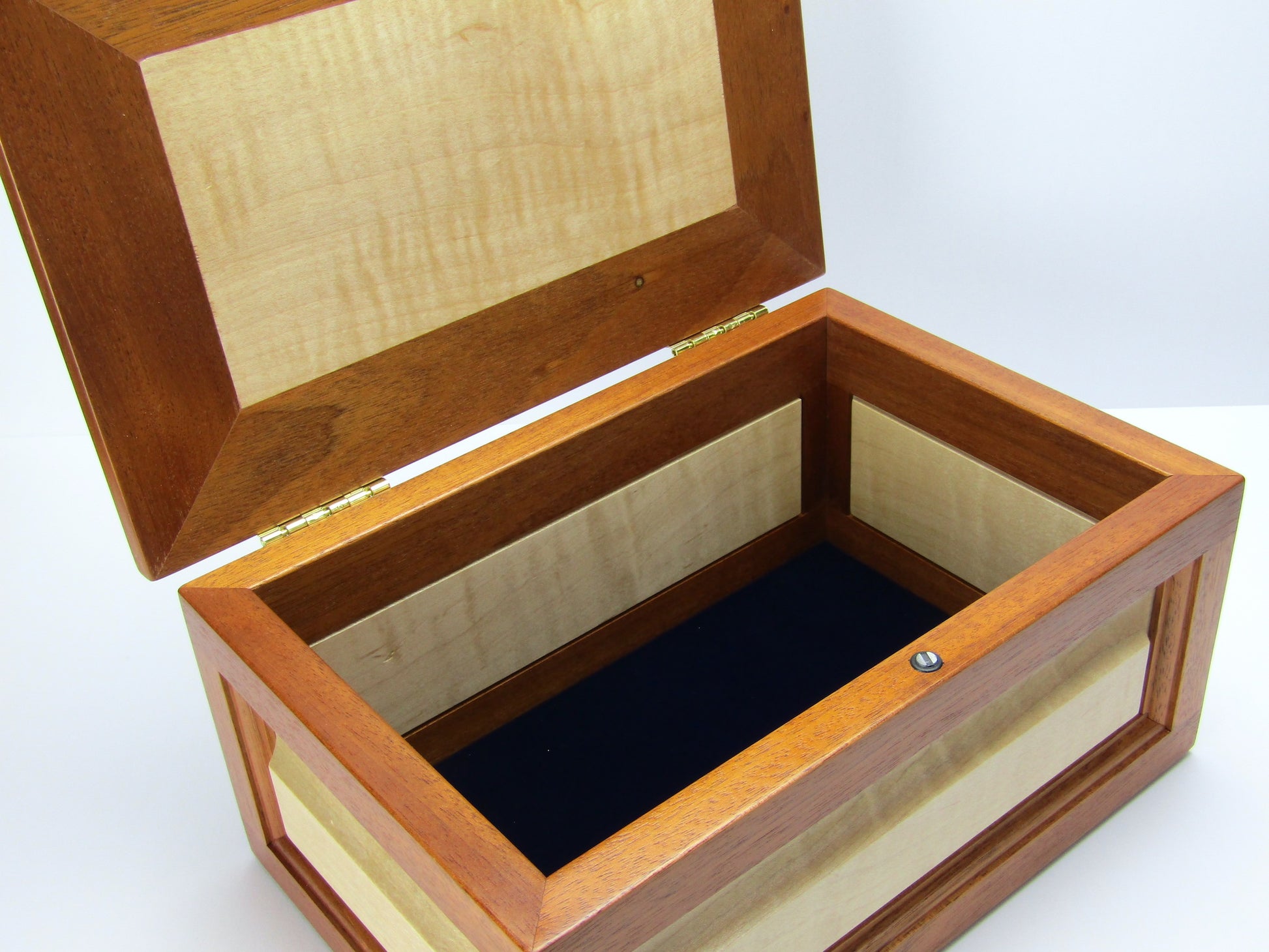 Interior view of large keepsake box handmade from Honduran mahogany, curly maple and pear wood by A Finer Cut Wood.