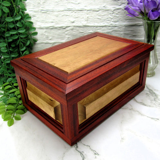 Thumbnail of large keepsake box with raised panels handcrafted from padauk and cherry wood by A Finer Cut.