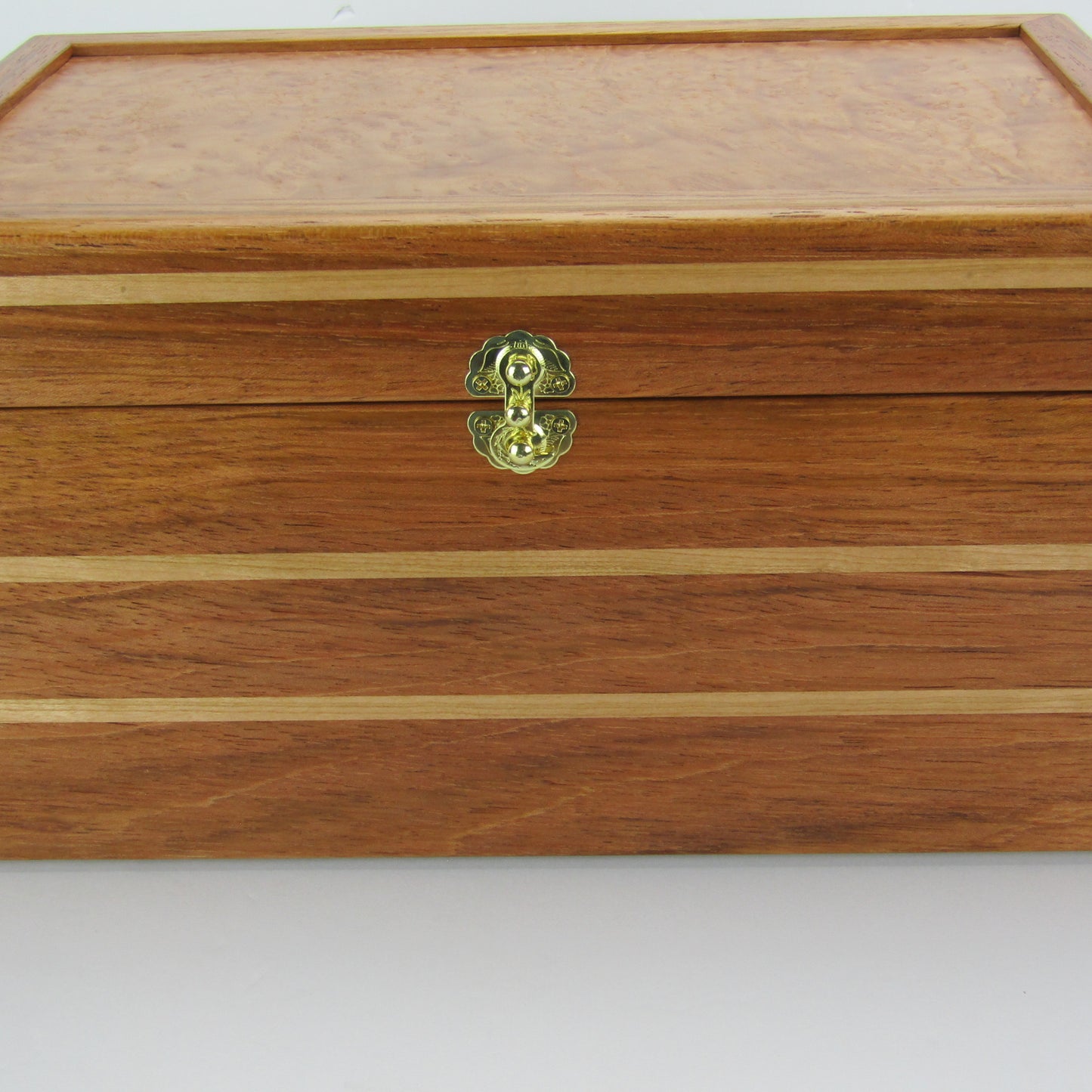 Front view of large memory box handmade from Brazilian cherry and maple burl veneer by A Finer Cut Woodworking.