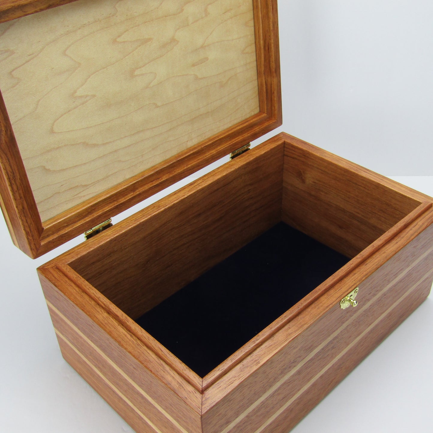 Interior view of large memory box handmade from Brazilian cherry and maple burl veneer by A Finer Cut Woodworking.
