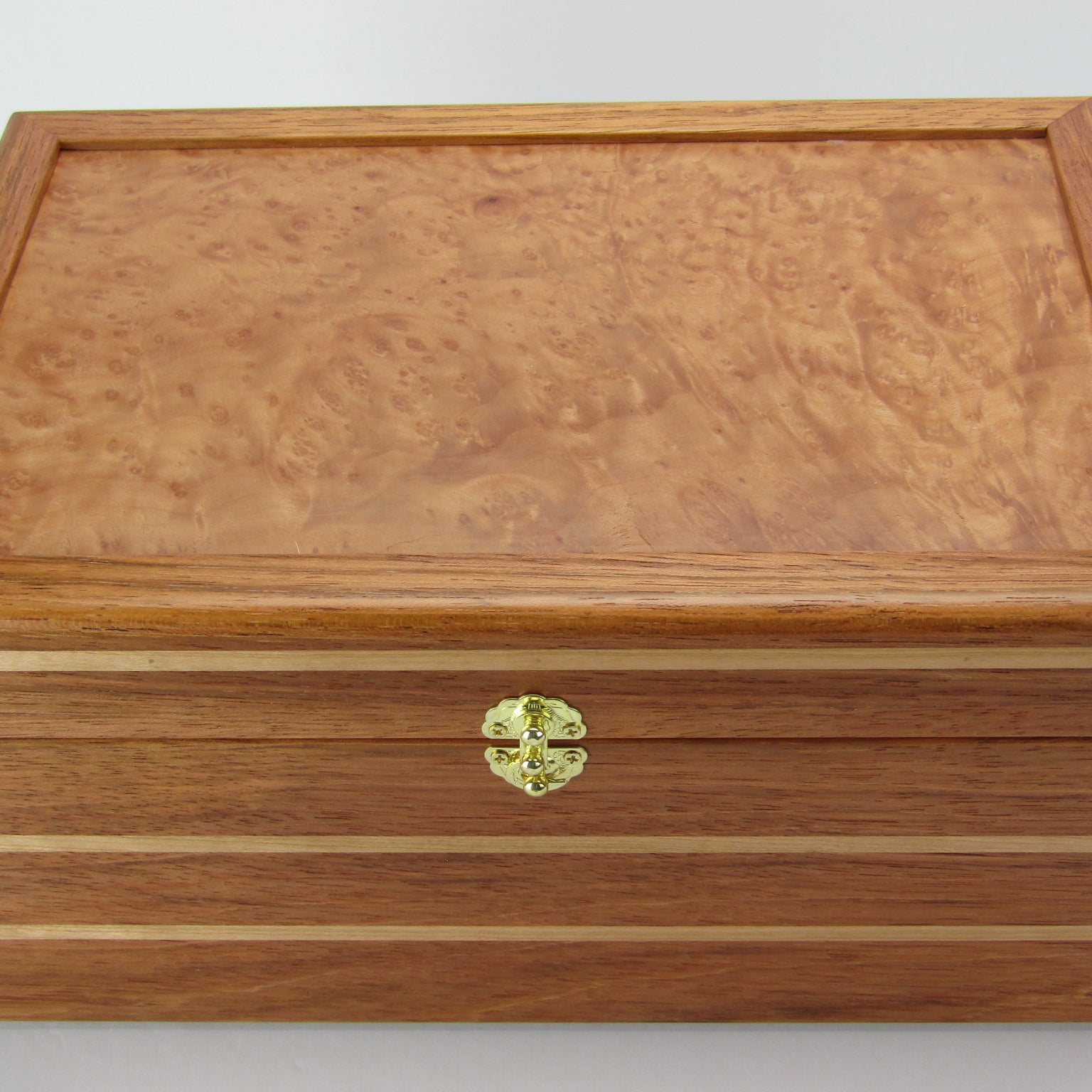 Top view of large memory box handmade from Brazilian cherry and maple burl veneer by A Finer Cut Woodworking.