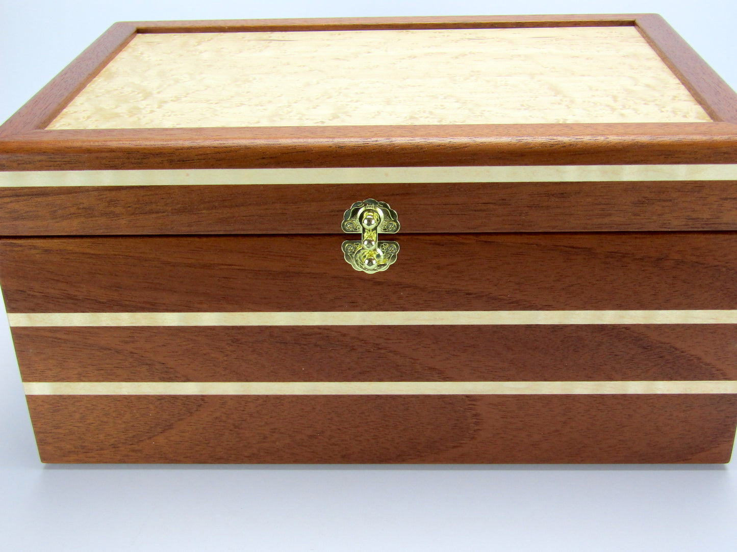 Inlays on large memory box handmade from Honduran mahogany with curly maple inlays by A Finer Cut Woodworking.