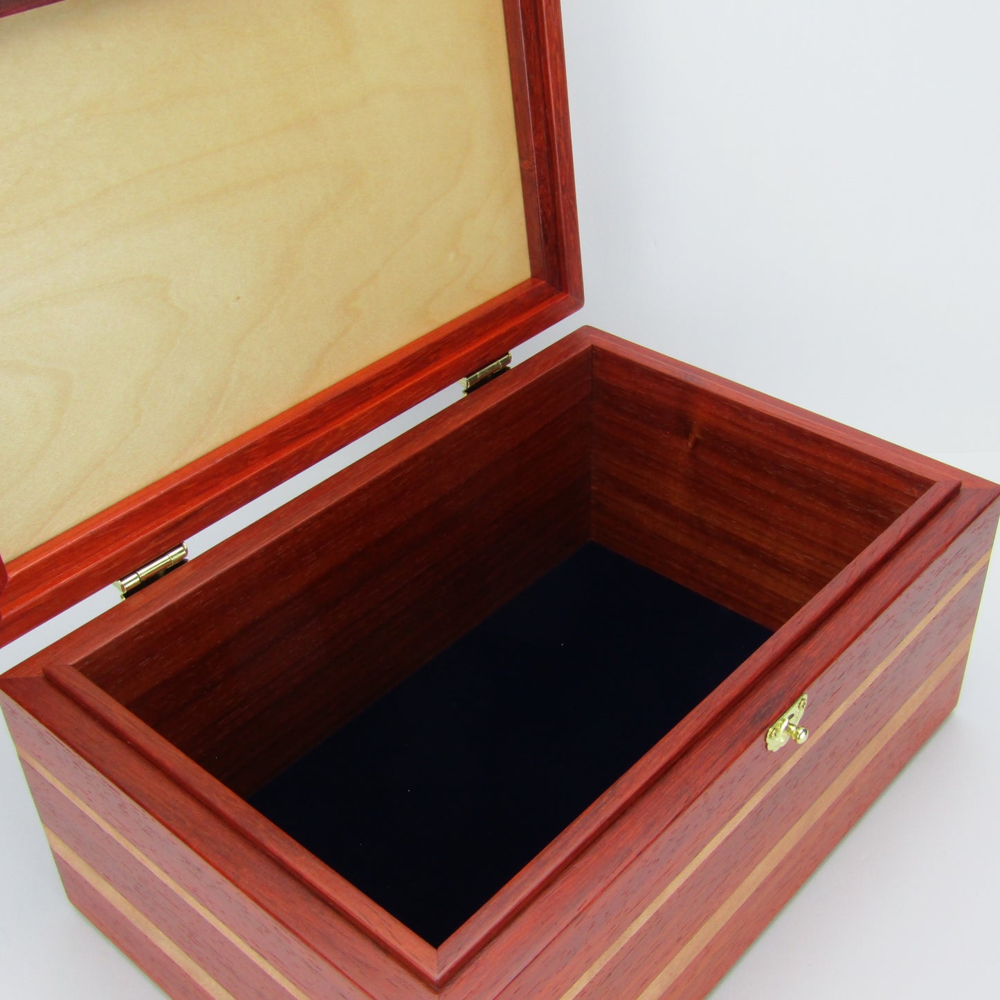 >Interior view of large memory box handmade from padauk and cherry wood by A Finer Cut Woodworking.