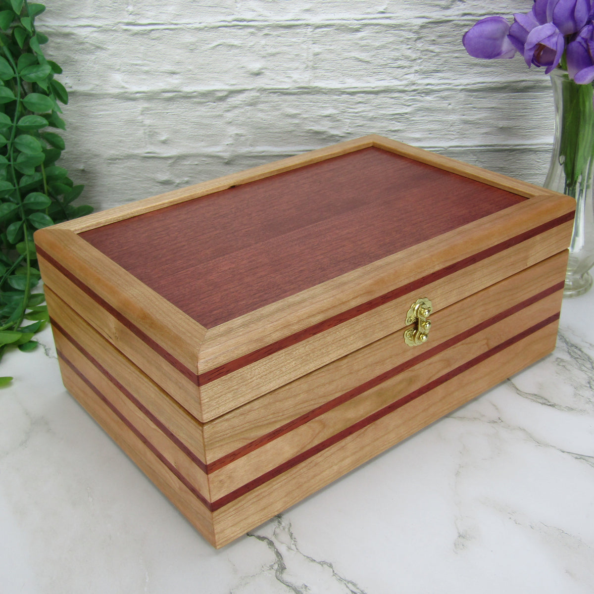 Thumbnail of unique memorial box handcrafted from domestic cherry, padauk, and dark finished cherry veneer by A Finer Cut Woodworking. 