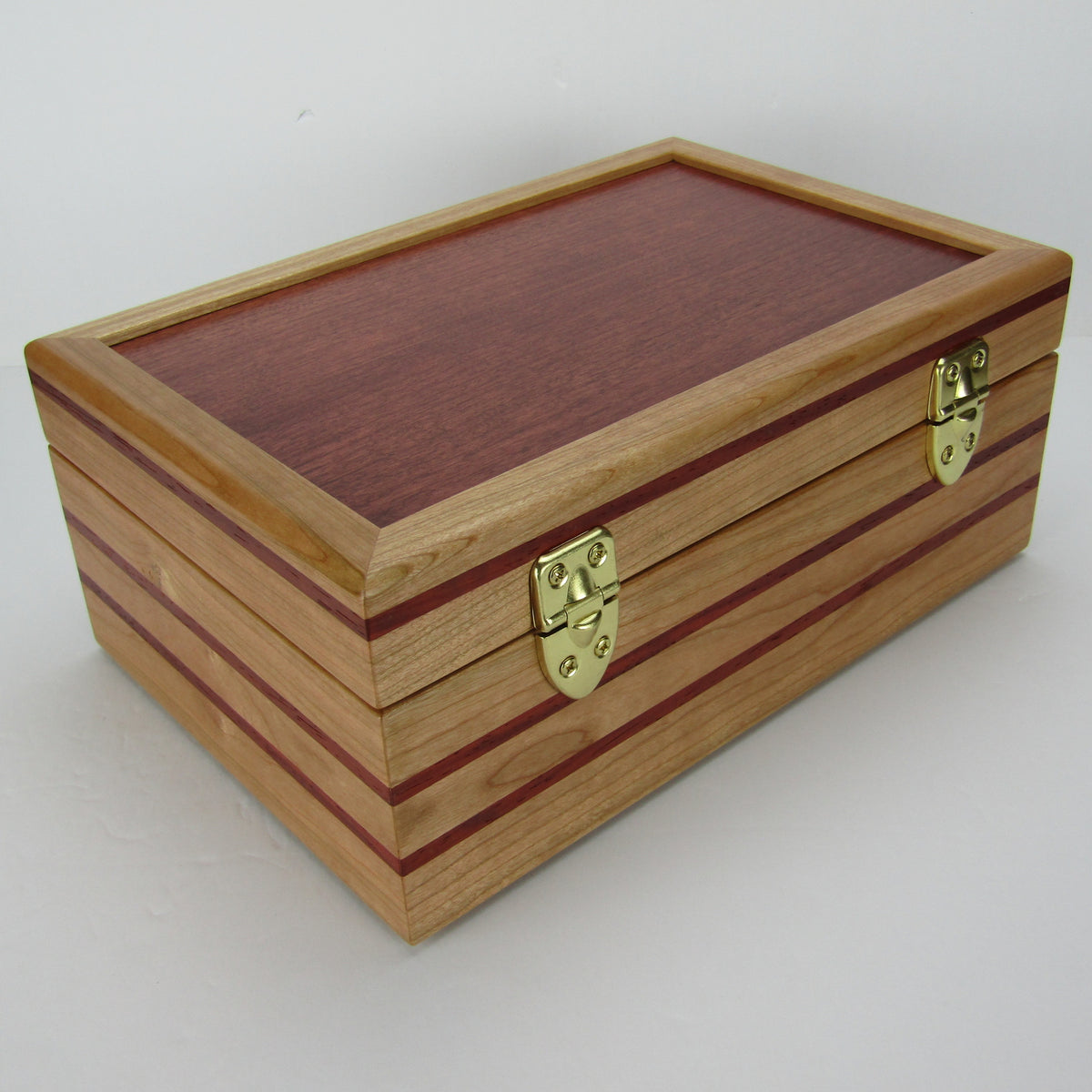 Back view of unique memorial box handcrafted from domestic cherry, padauk, and dark finished cherry veneer by A Finer Cut Woodworking. 