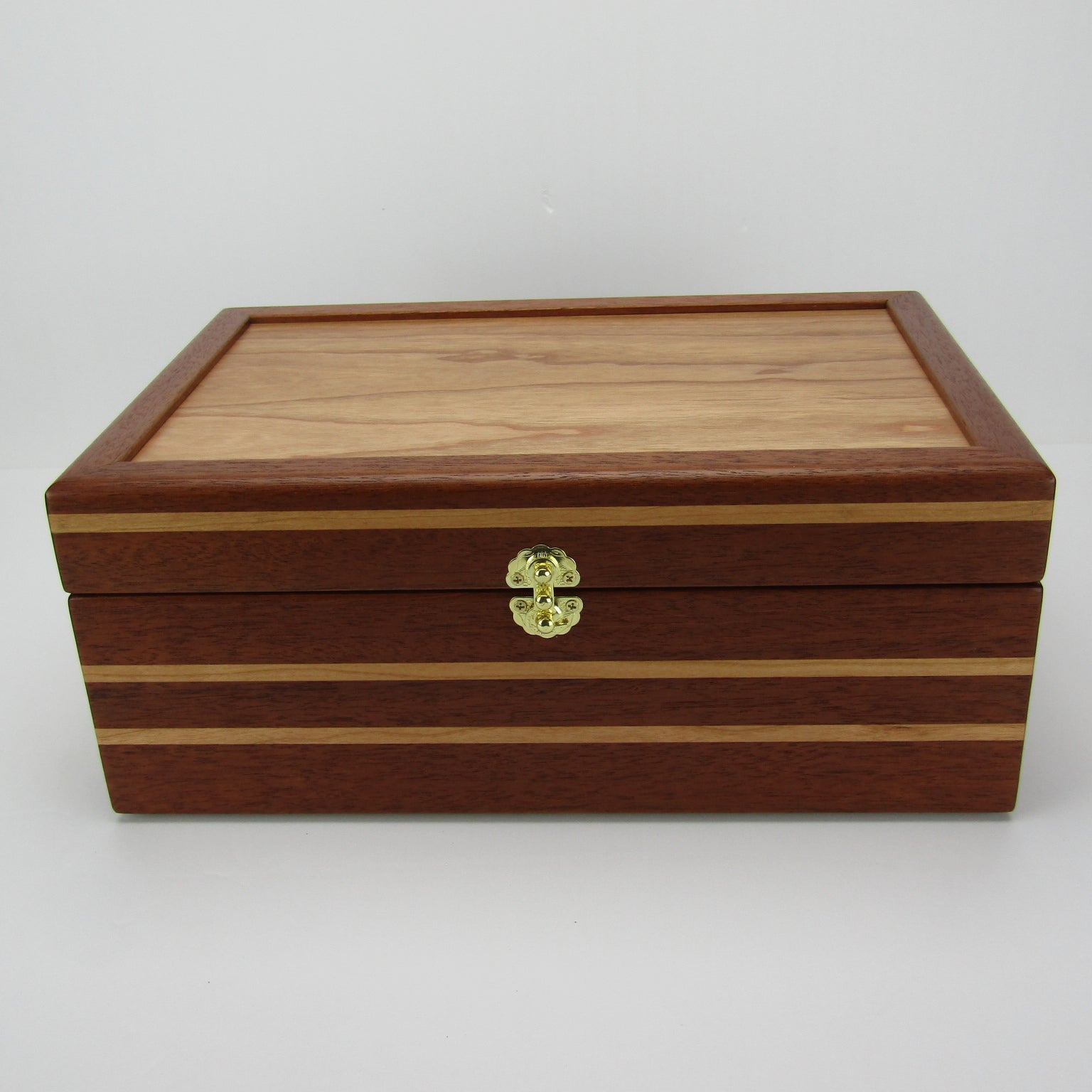 Front view of unique memorial box handcrafted from Honduran mahogany and cherry by A Finer Cut Woodworking. 