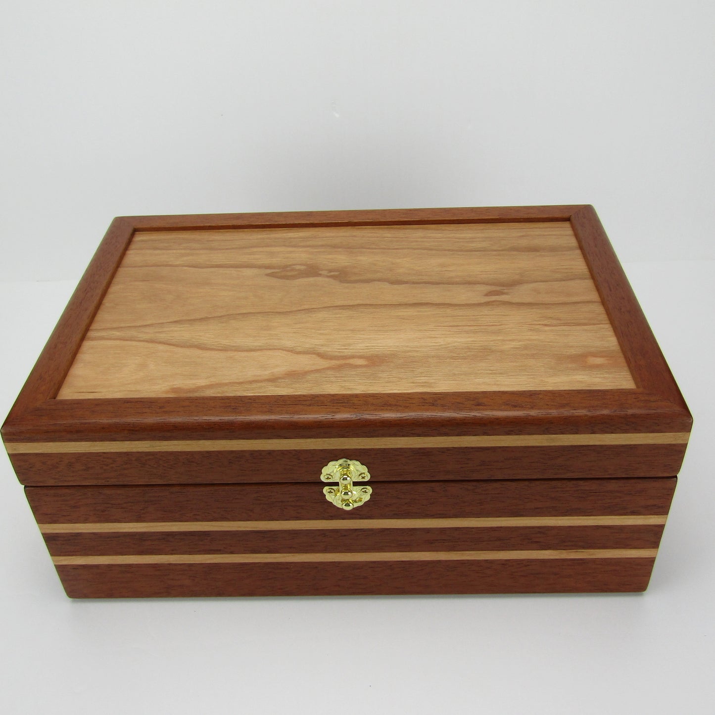 Top view of unique memorial box handcrafted from Honduran mahogany and cherry by A Finer Cut Woodworking. 