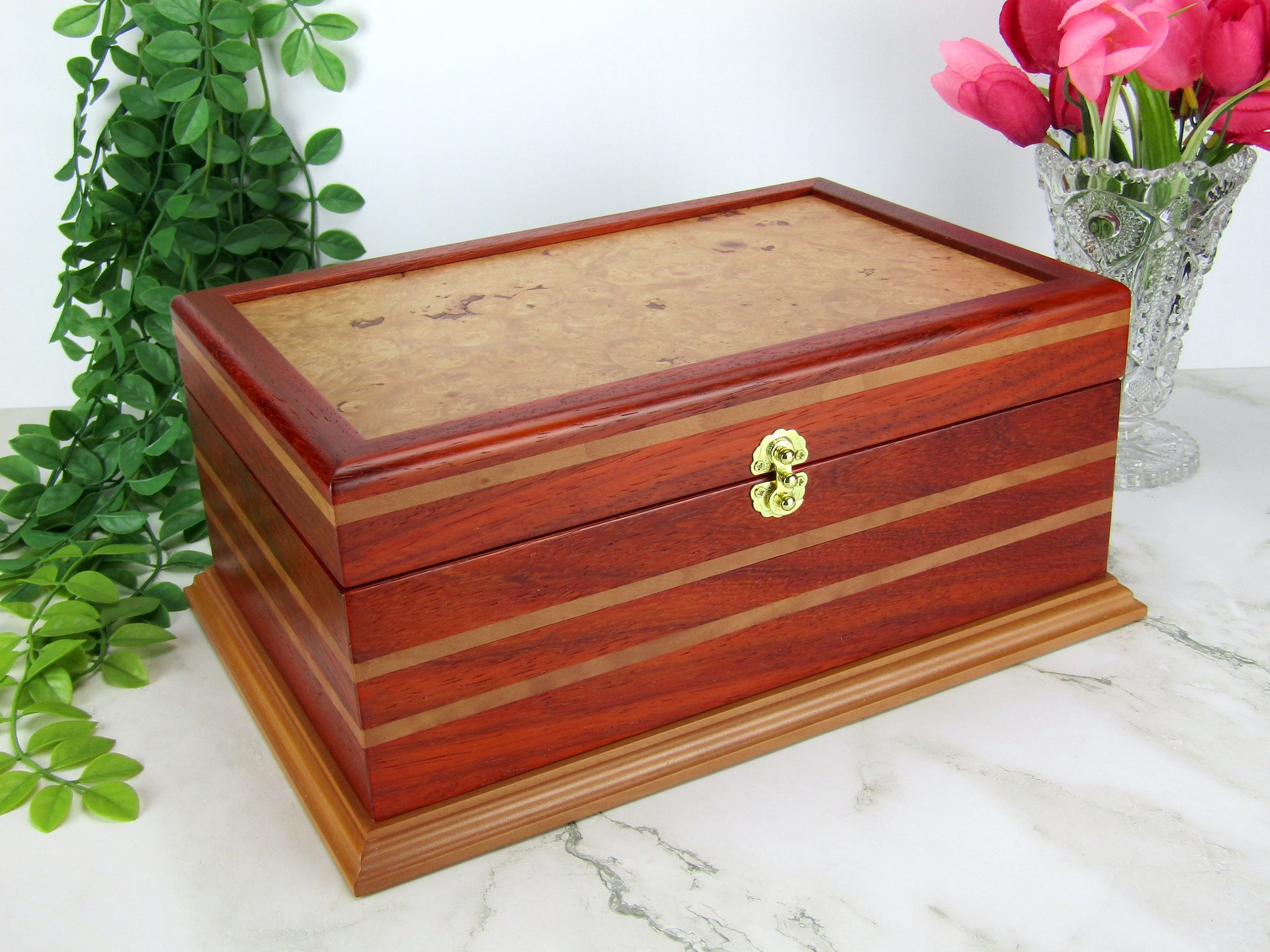 Thumbnail of unique memorial box handcrafted from red padauk and pear wood by A Finer Cut Woodworking. 