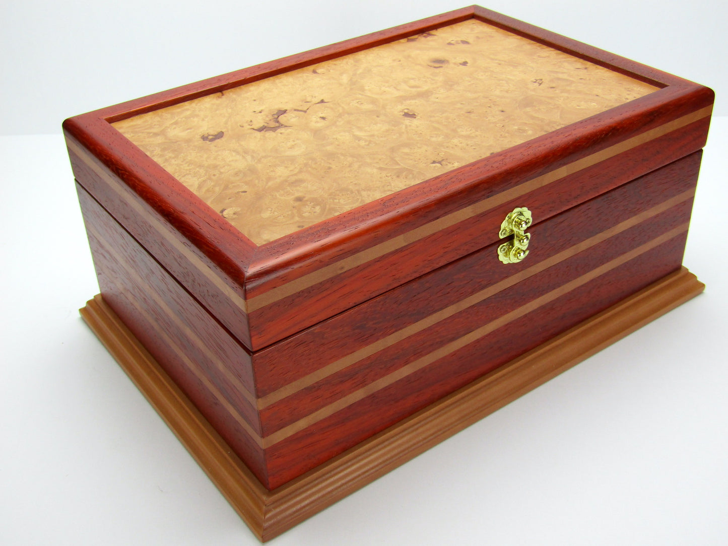 Front view of unique memorial box handcrafted from red padauk and pear wood by A Finer Cut Woodworking. 