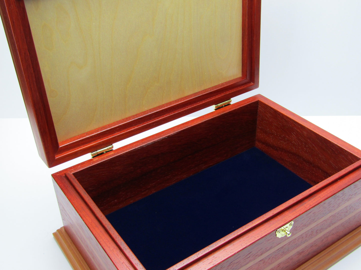 Interior view of unique memorial box handcrafted from red padauk and pear wood by A Finer Cut Woodworking. 