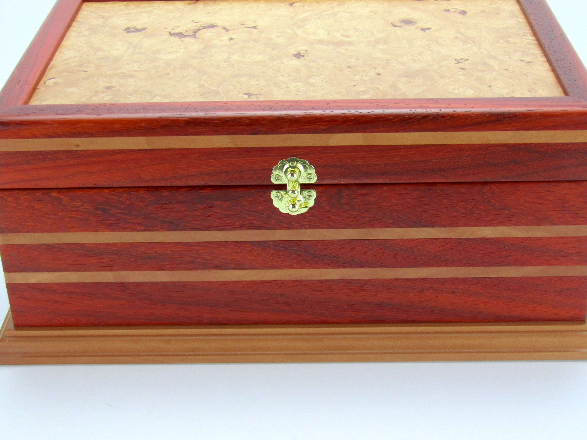 Inlays on unique memorial box handcrafted from red padauk and pear wood by A Finer Cut Woodworking. 