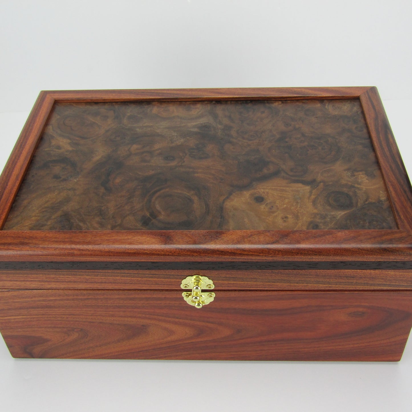>Top view of unique memorial box handcrafted from Bolivian rosewood, wenge, and walnut burl veneer by A Finer Cut Woodworking. 