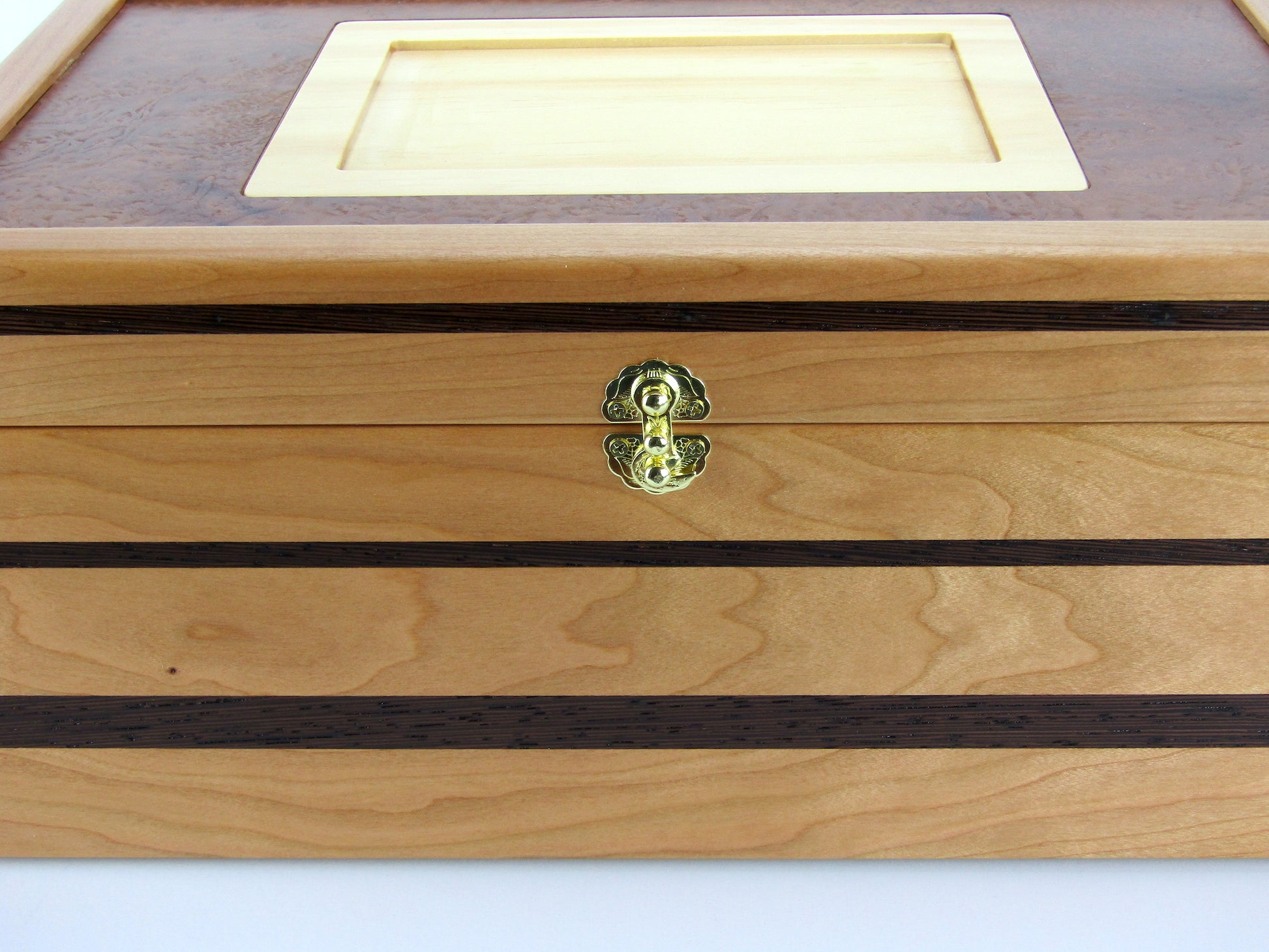 Inlays on memorial box handcrafted from cherry, mahogany and wenge wood by A Finer Cut Woodworking. 