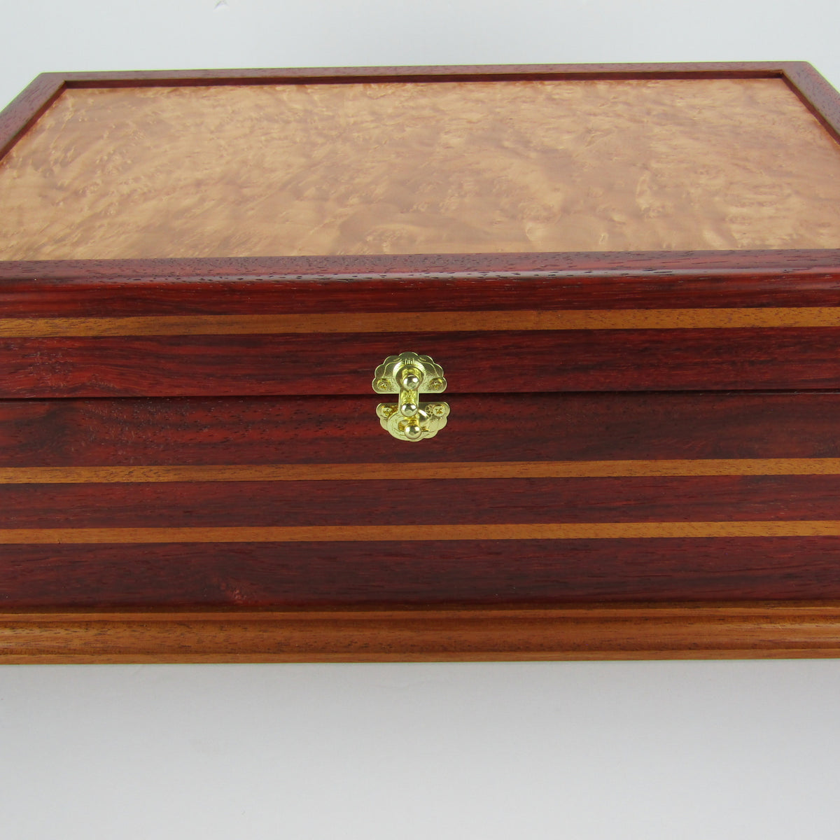 Front view of unique memorial keepsake box handmade from padauk, mahogany, and maple burl veneer  by A Finer Cut Woodworking.