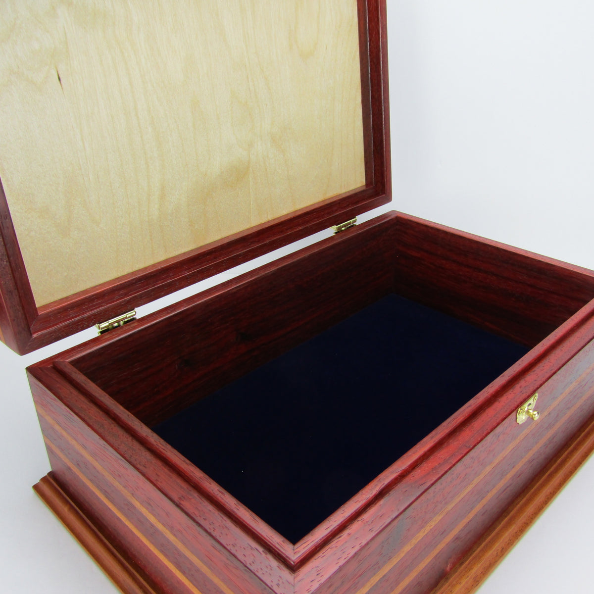 Interior view of unique memorial keepsake box handmade from padauk, mahogany, and maple burl veneer  by A Finer Cut Woodworking.