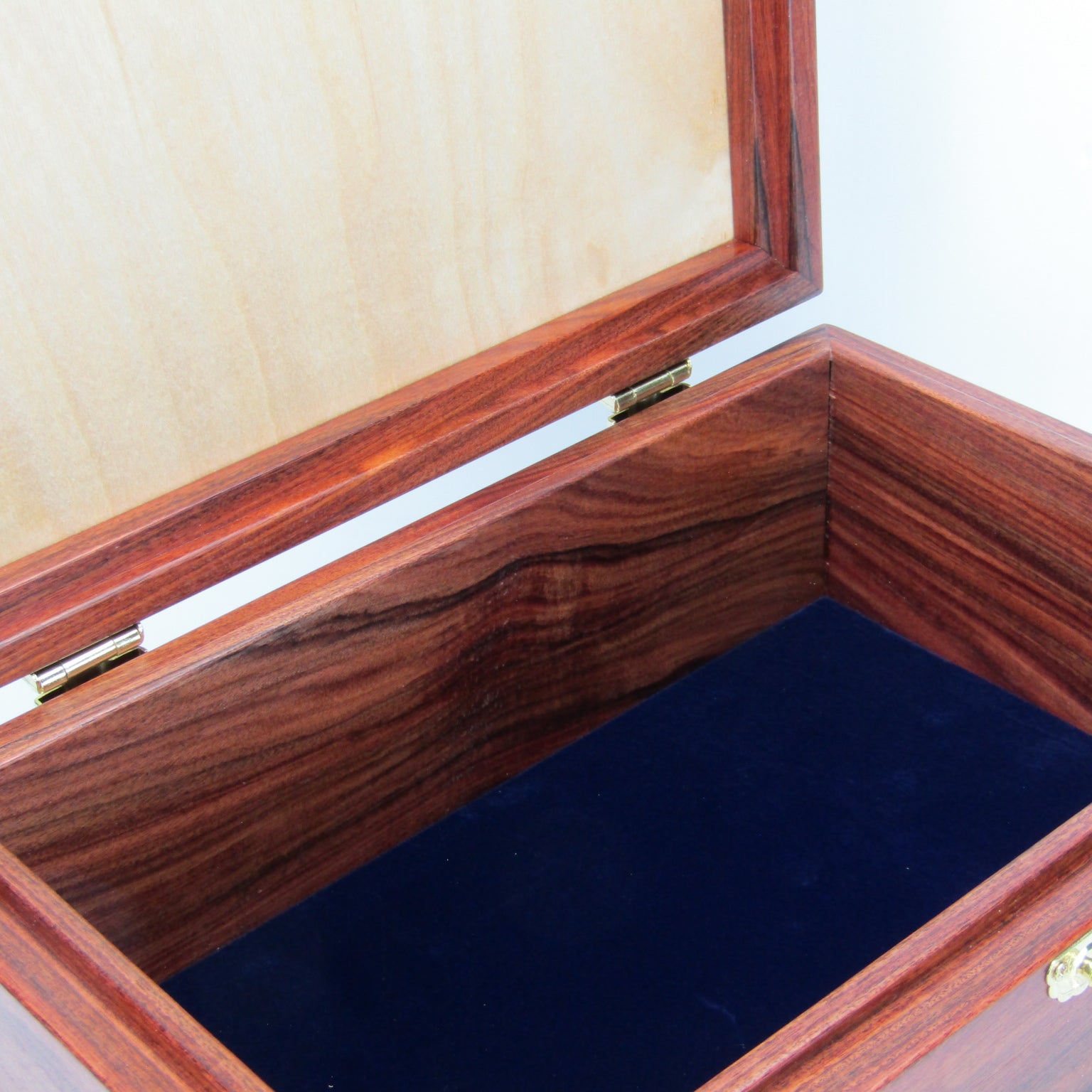 Interior view of unique memorial keepsake box handmade from Bolivian rosewood and padauk by A Finer Cut Woodworking.