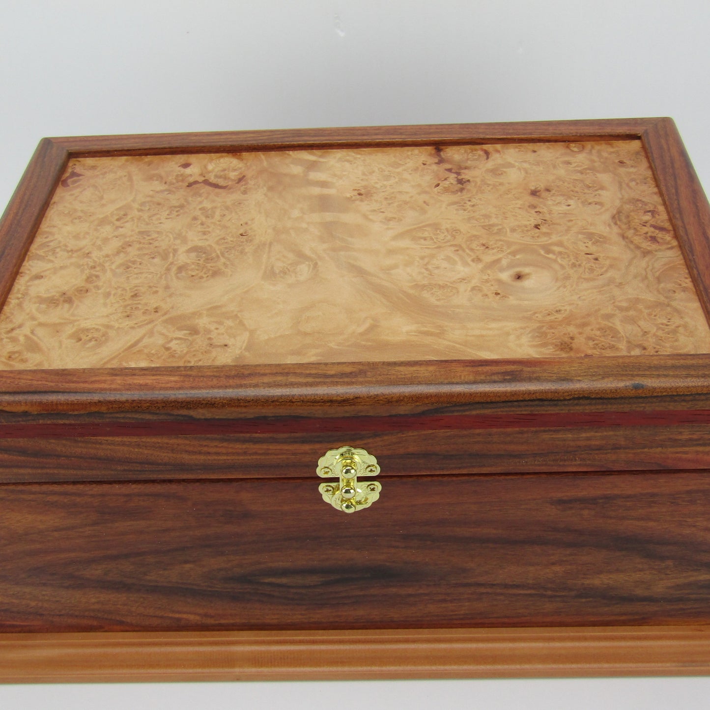 Top view of unique memorial keepsake box handmade from Bolivian rosewood and padauk by A Finer Cut Woodworking.