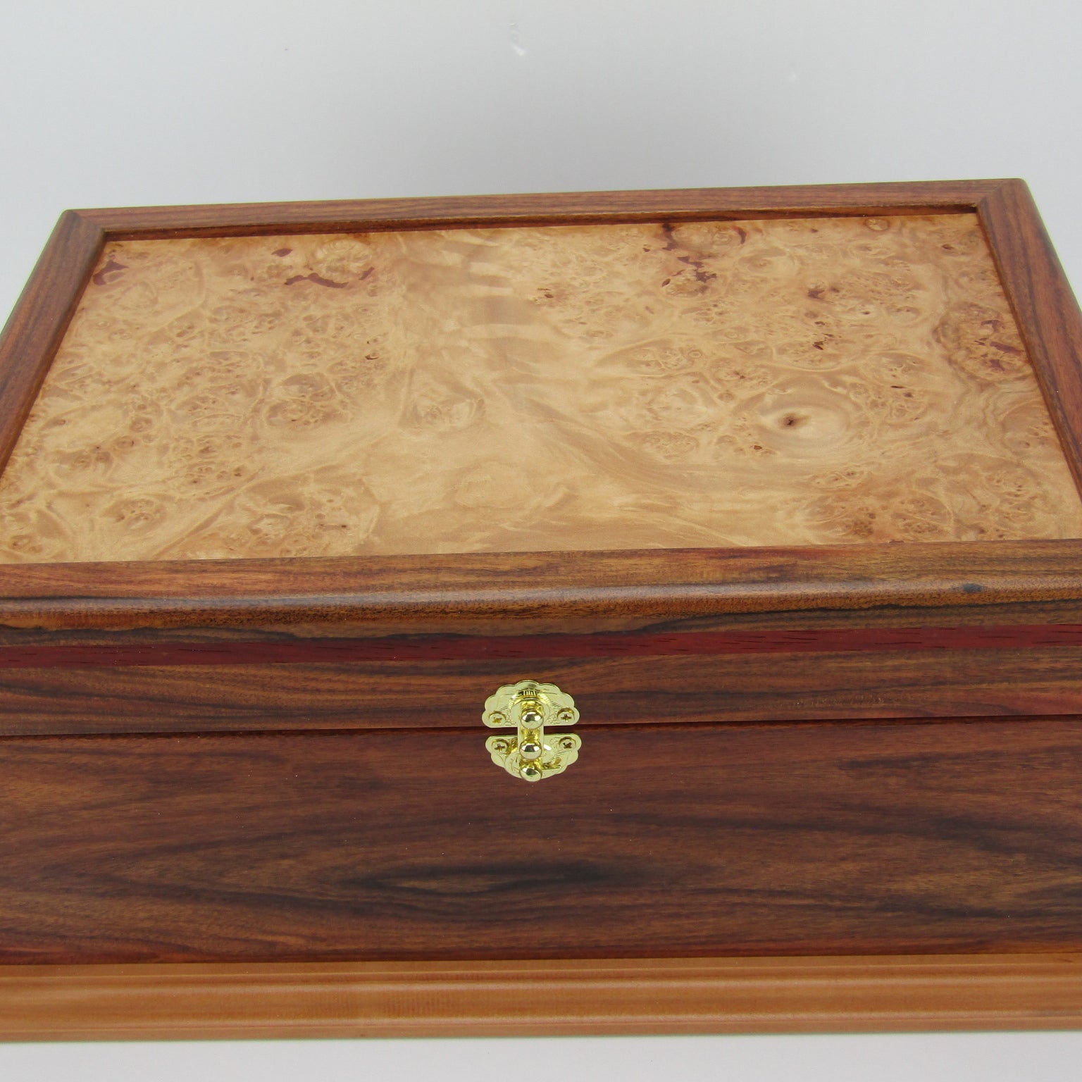 Top view of unique memorial keepsake box handmade from Bolivian rosewood and padauk by A Finer Cut Woodworking.