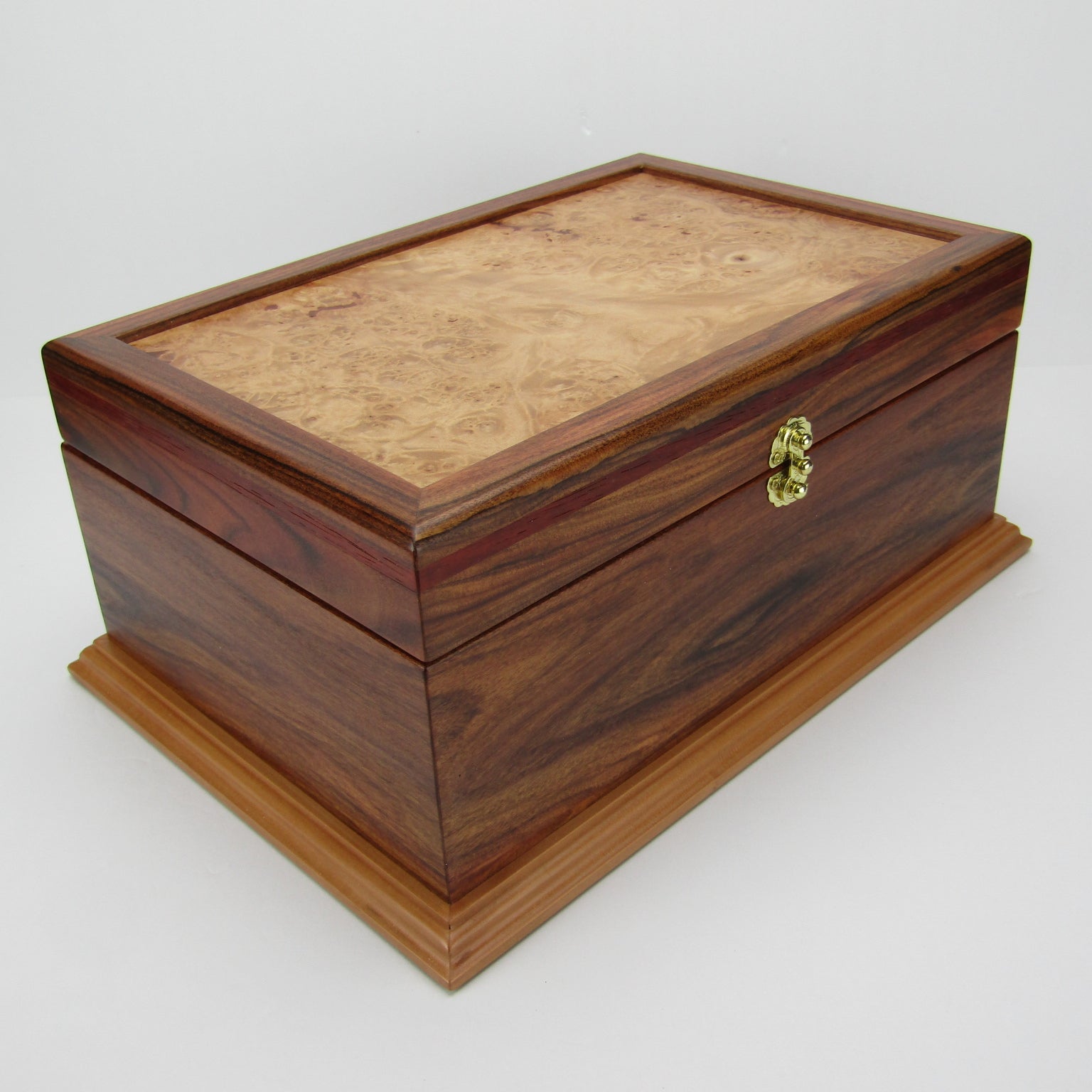 Front corner view of unique memorial keepsake box handmade from Bolivian rosewood and padauk by A Finer Cut Woodworking.