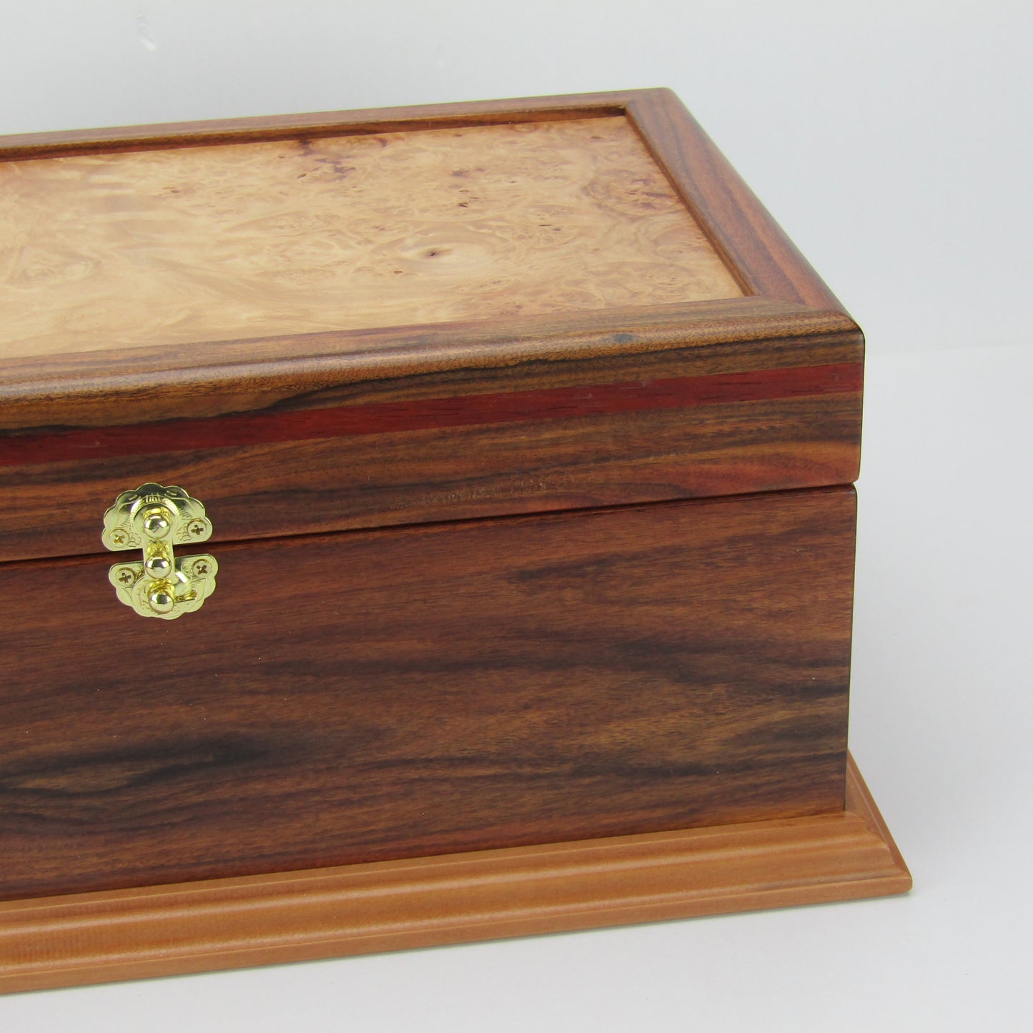 Lid detail of unique memorial keepsake box handmade from Bolivian rosewood and padauk by A Finer Cut Woodworking.