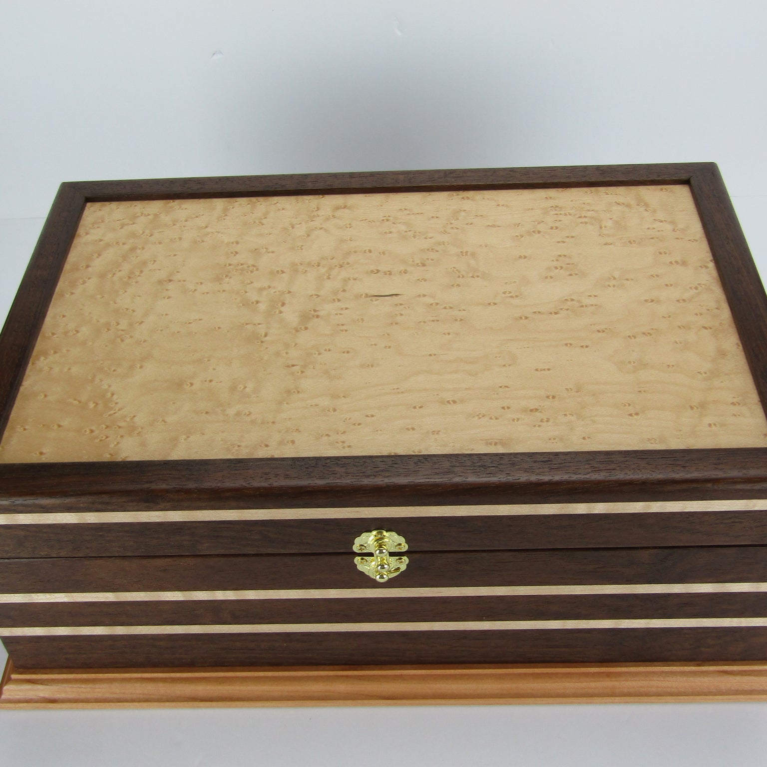 Top view of unique memorial keepsake box handmade from Peruvian walnut, curly maple, cherry, and bird's eye maple veneer  by A Finer Cut Woodworking.