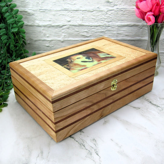 Thumbnail of pet memorial box handmade from cherry, mahogany, and birds eye maple veneer by A Finer Cut Woodwork.
