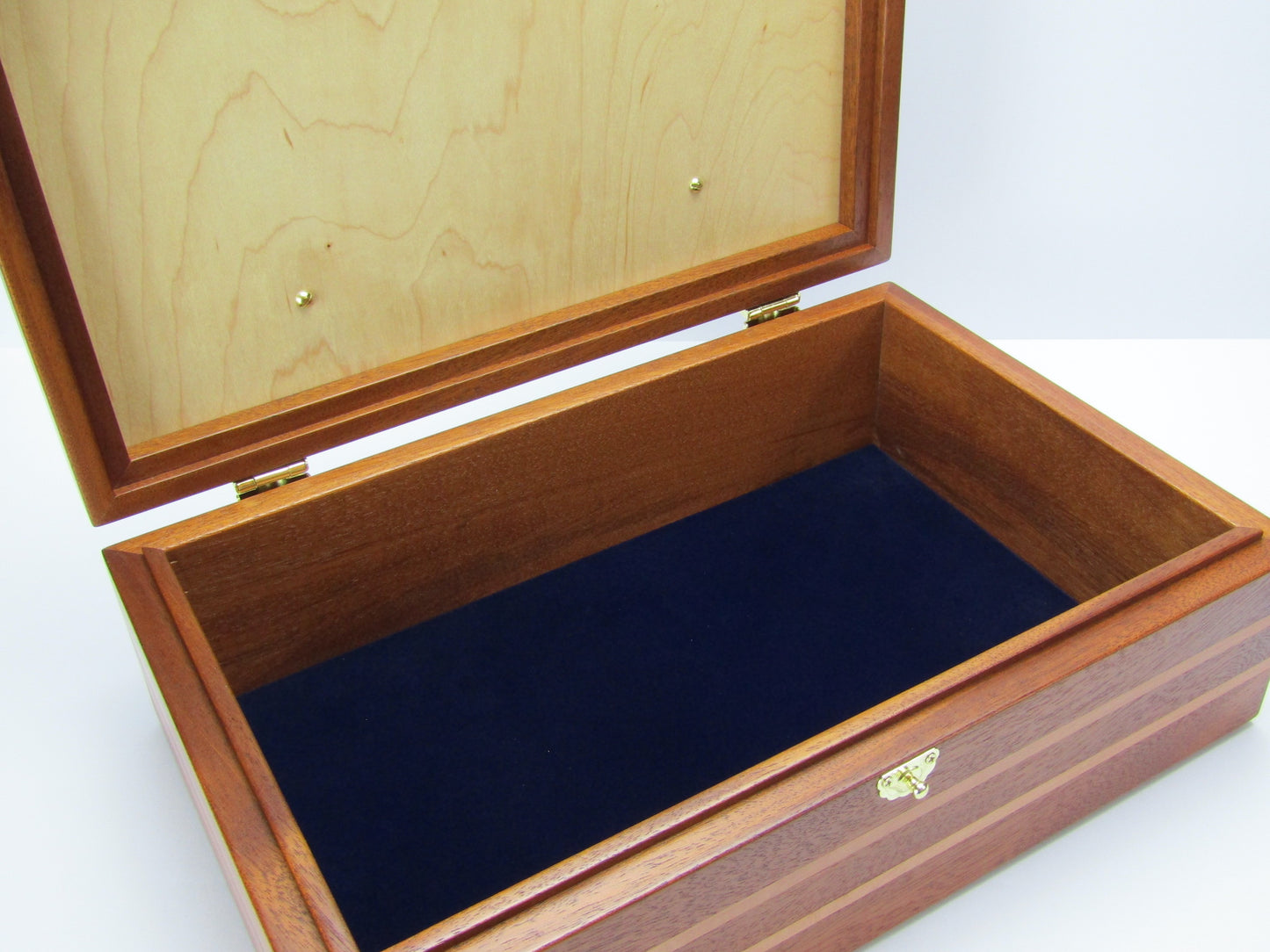 Interior view of pet memorial box handmade from Honduran mahogany and pear wood by A Finer Cut Woodwork.