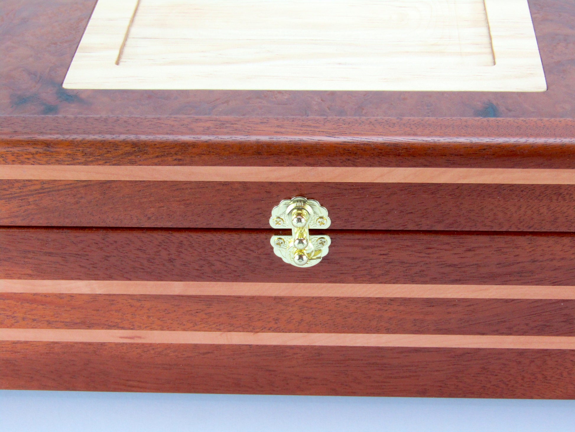 Inlays on pet memorial box handmade from Honduran mahogany and pear wood by A Finer Cut Woodwork.