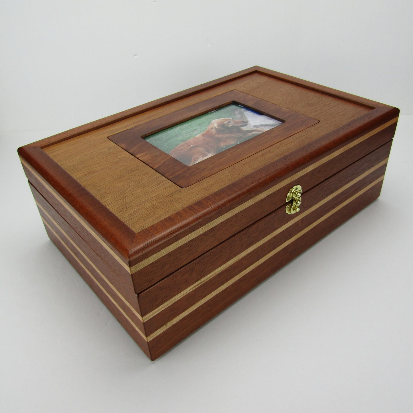 Front corner view of pet memory box with photo lid handmade from Honduran mahogany and cherry by A Finer Cut Woodworking.