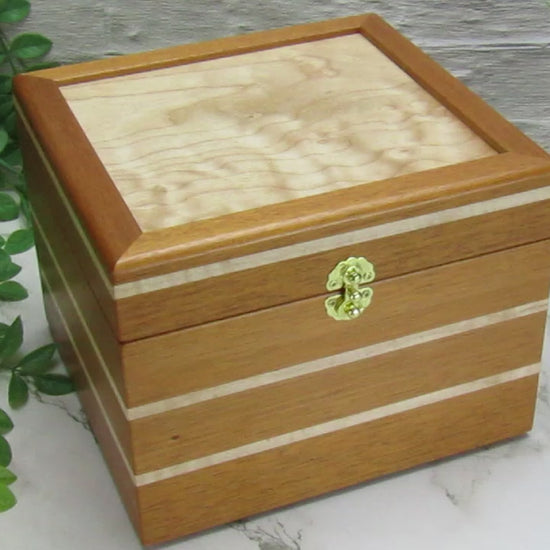 Video showing details of unique small keepsake box handmade from mahogany and maple wood by A Finer Cut Woodworking. 