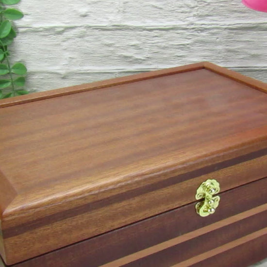 Video showing details of handmade memory box crafted from mahogany, cherry, and mahogany veneer by A Finer Cut Woodworking. 