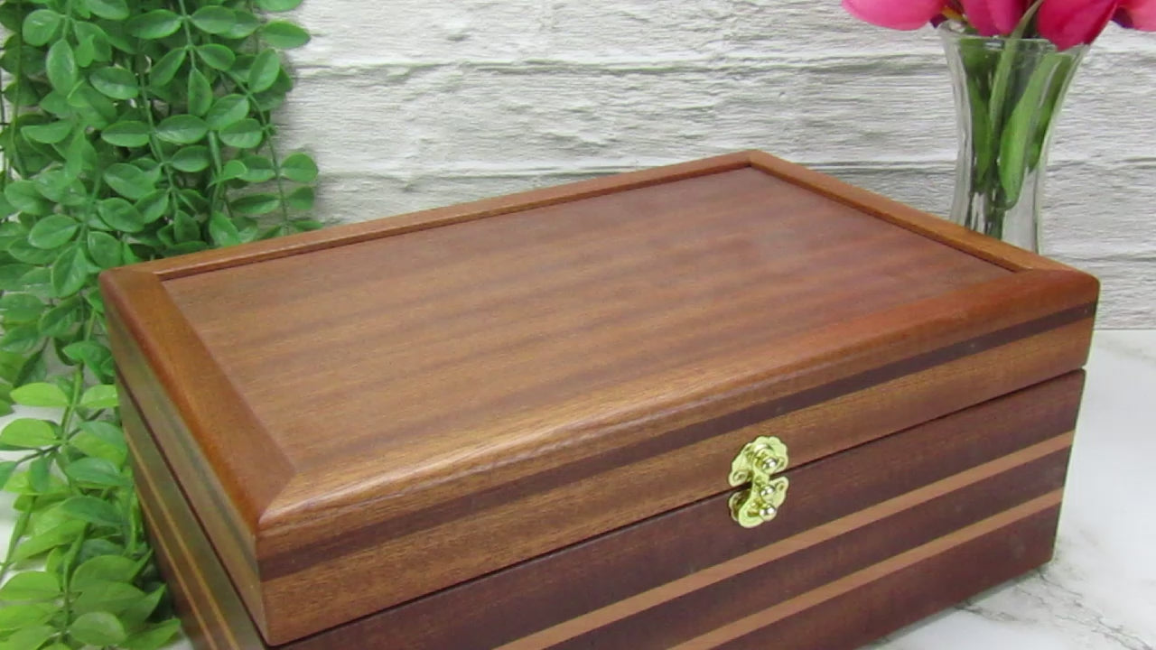 Video showing details of handmade memory box crafted from mahogany, cherry, and mahogany veneer by A Finer Cut Woodworking. 