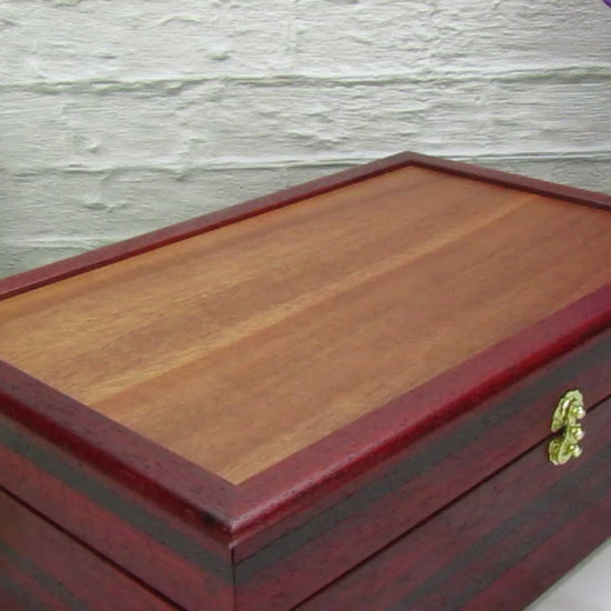 Video showing details of wooden keepsake box handmade from padauk, wenge, and cherry veneer by A Finer Cut Woodworking.