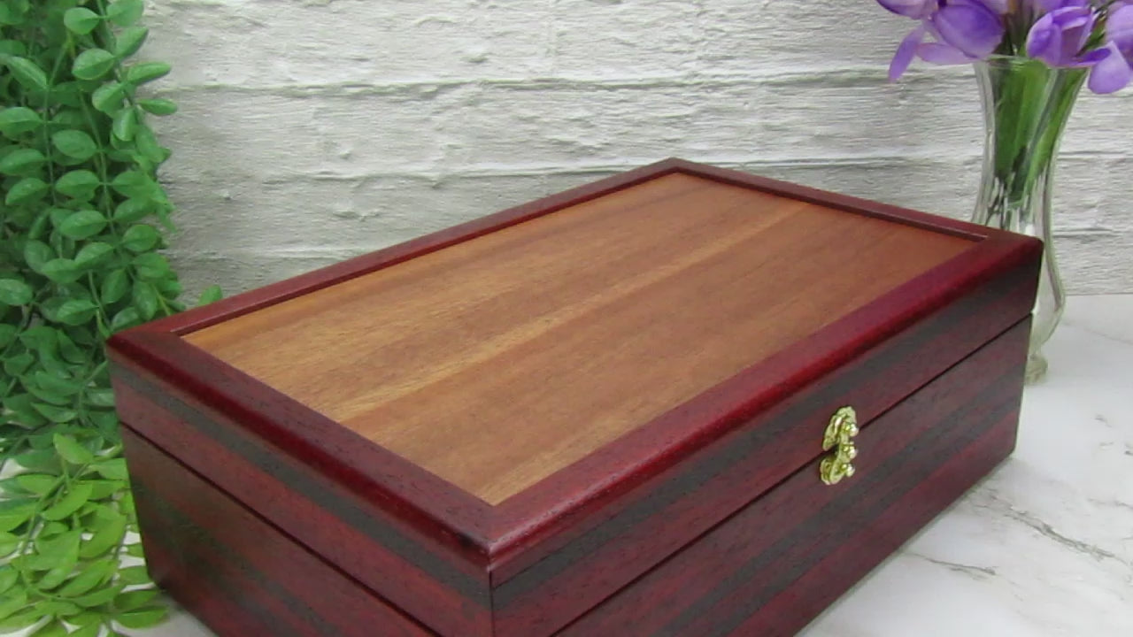 Video showing details of wooden keepsake box handmade from padauk, wenge, and cherry veneer by A Finer Cut Woodworking.