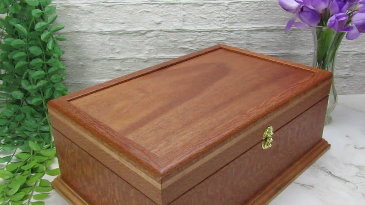 Video showing details of handmade keepsake box crafted from leopardwood, cherry, and mahogany veneer by A Finer Cut Woodworking.