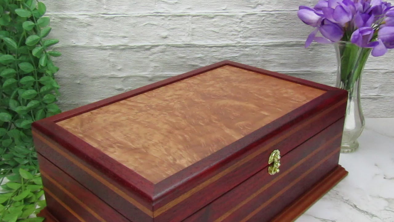 Video showing details of unique memorial keepsake box handmade from padauk, mahogany, and maple burl veneer  by A Finer Cut Woodworking.