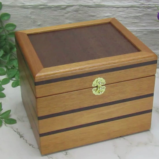 Video showing details of small wooden memory box handmade from mahogany, wenge and Peruvian walnut by A Finer Cut.