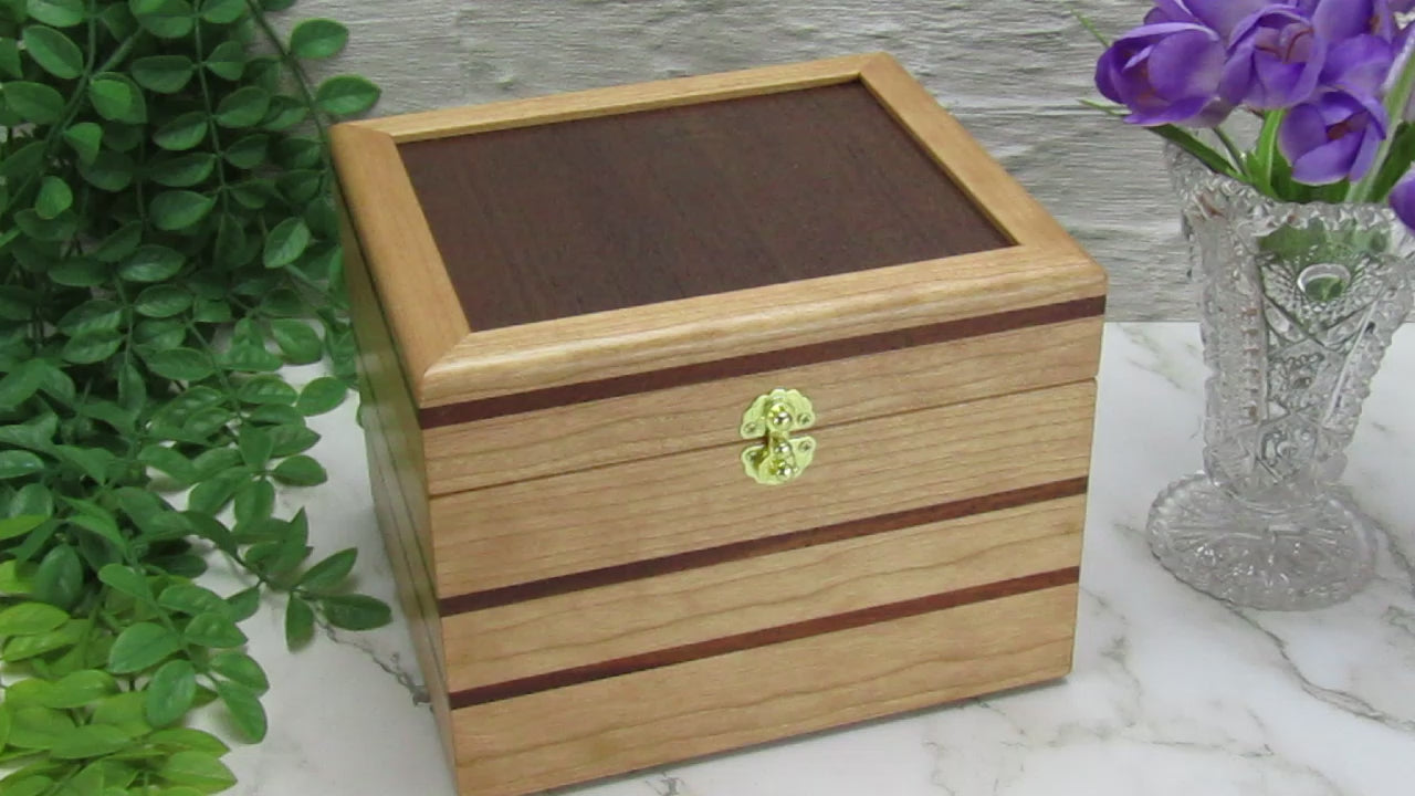 Video showing details of unique small keepsake box handmade from cherry, mahogany and Peruvian walnut wood by A Finer Cut.