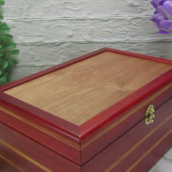 Video showing details of large memory box handmade from padauk and canary wood by A Finer Cut Woodworking.