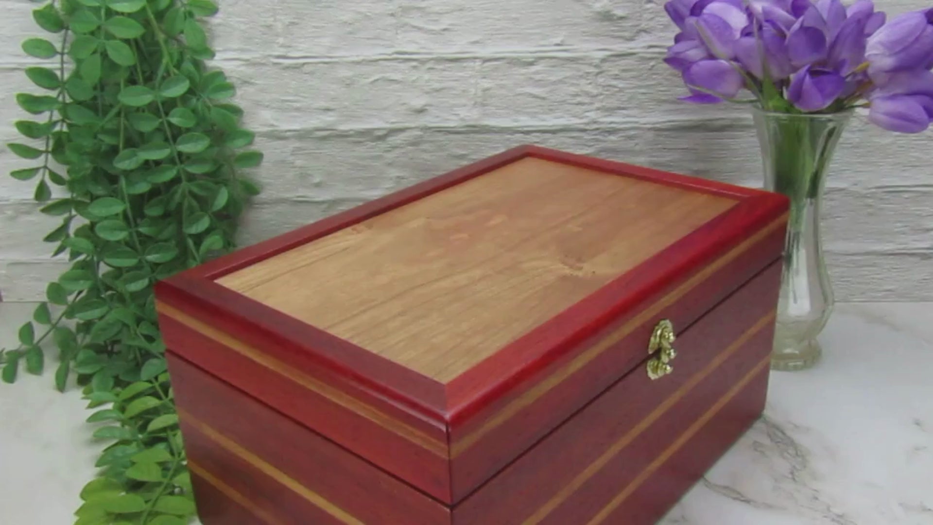 Video showing details of large memory box handmade from padauk and canary wood by A Finer Cut Woodworking.