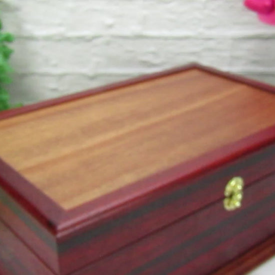 Video showing details of wooden keepsake box handmade from padauk, wenge, and cherry veneer by A Finer Cut Woodworking.