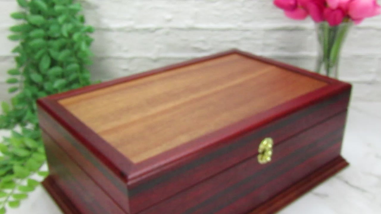 Video showing details of wooden keepsake box handmade from padauk, wenge, and cherry veneer by A Finer Cut Woodworking.
