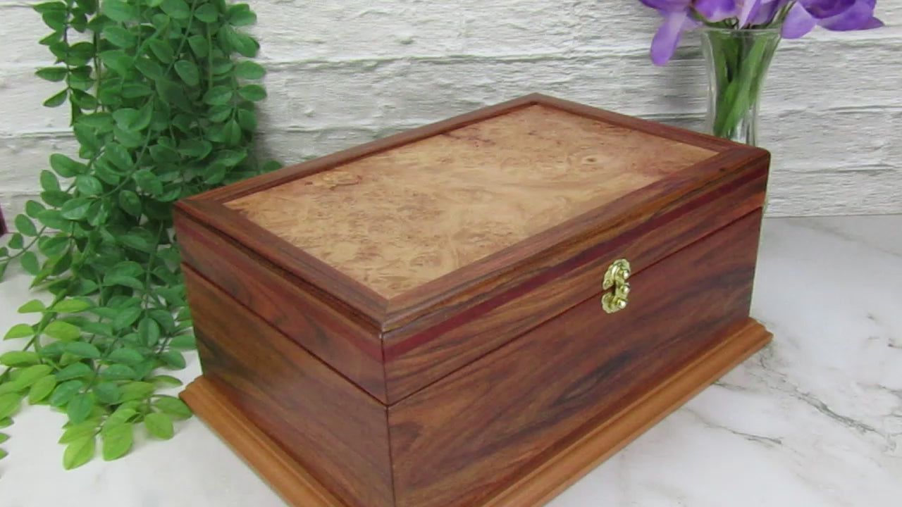 Video showing details of unique memorial keepsake box handmade from Bolivian rosewood and padauk by A Finer Cut Woodworking.