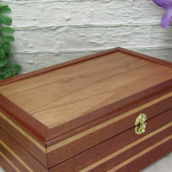Video showing details of unique memorial box handcrafted from Honduran mahogany and cherry by A Finer Cut Woodworking. 