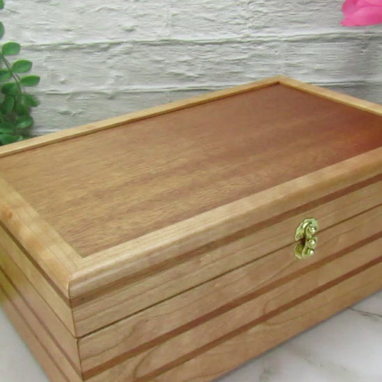 Video showing details of wooden keepsake box handmade from domestic cherry and mahogany wood by A Finer Cut Woodworking.