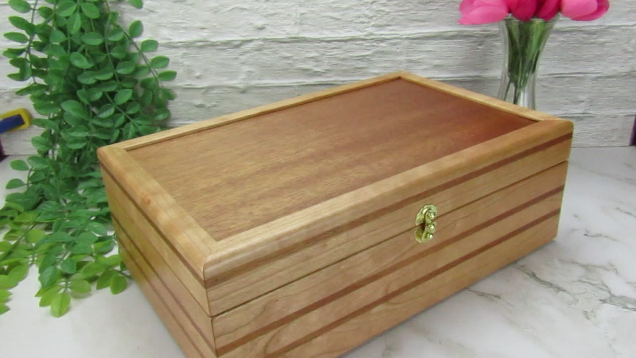 Video showing details of wooden keepsake box handmade from domestic cherry and mahogany wood by A Finer Cut Woodworking.