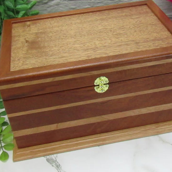 Video showing details of large keepsake box handmade from Honduran mahogany and cherry wood by A Finer Cut Woodworking.