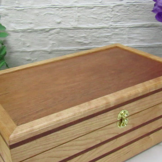 Video showing details of wooden keepsake box handmade from cherry, mahogany, and mahogany veneer by A Finer Cut Woodworking.