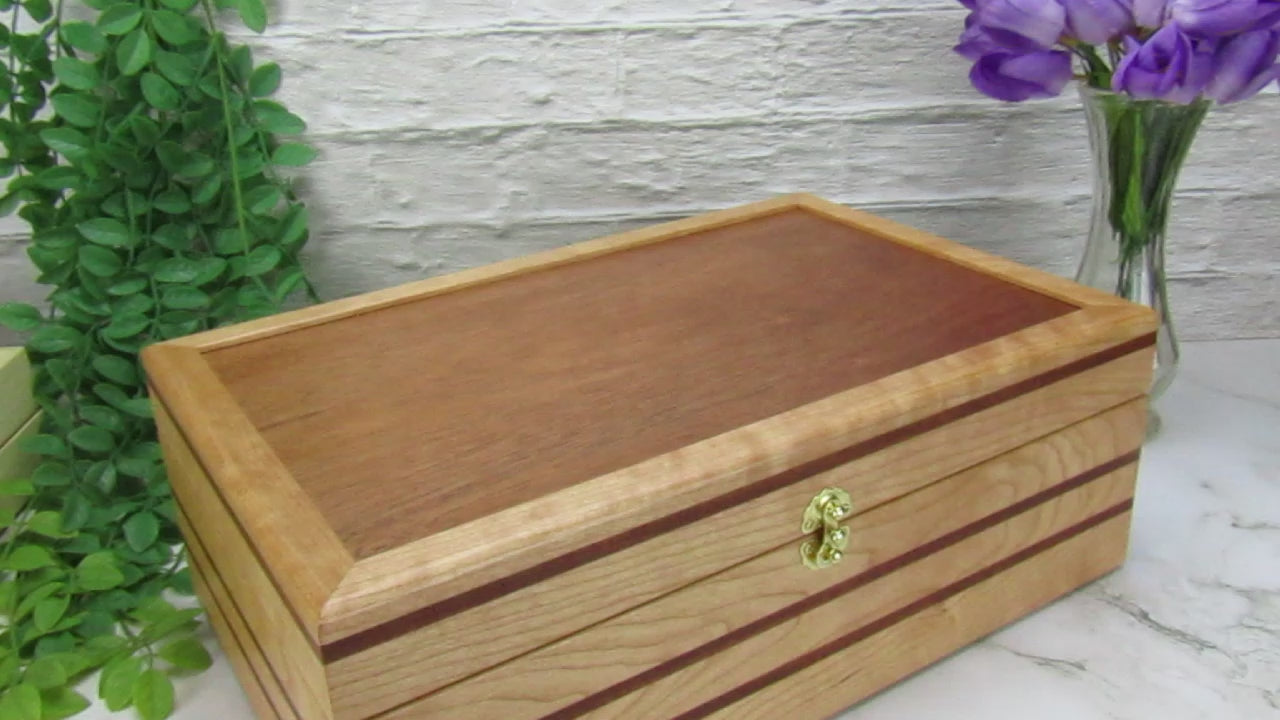 Video showing details of wooden keepsake box handmade from cherry, mahogany, and mahogany veneer by A Finer Cut Woodworking.