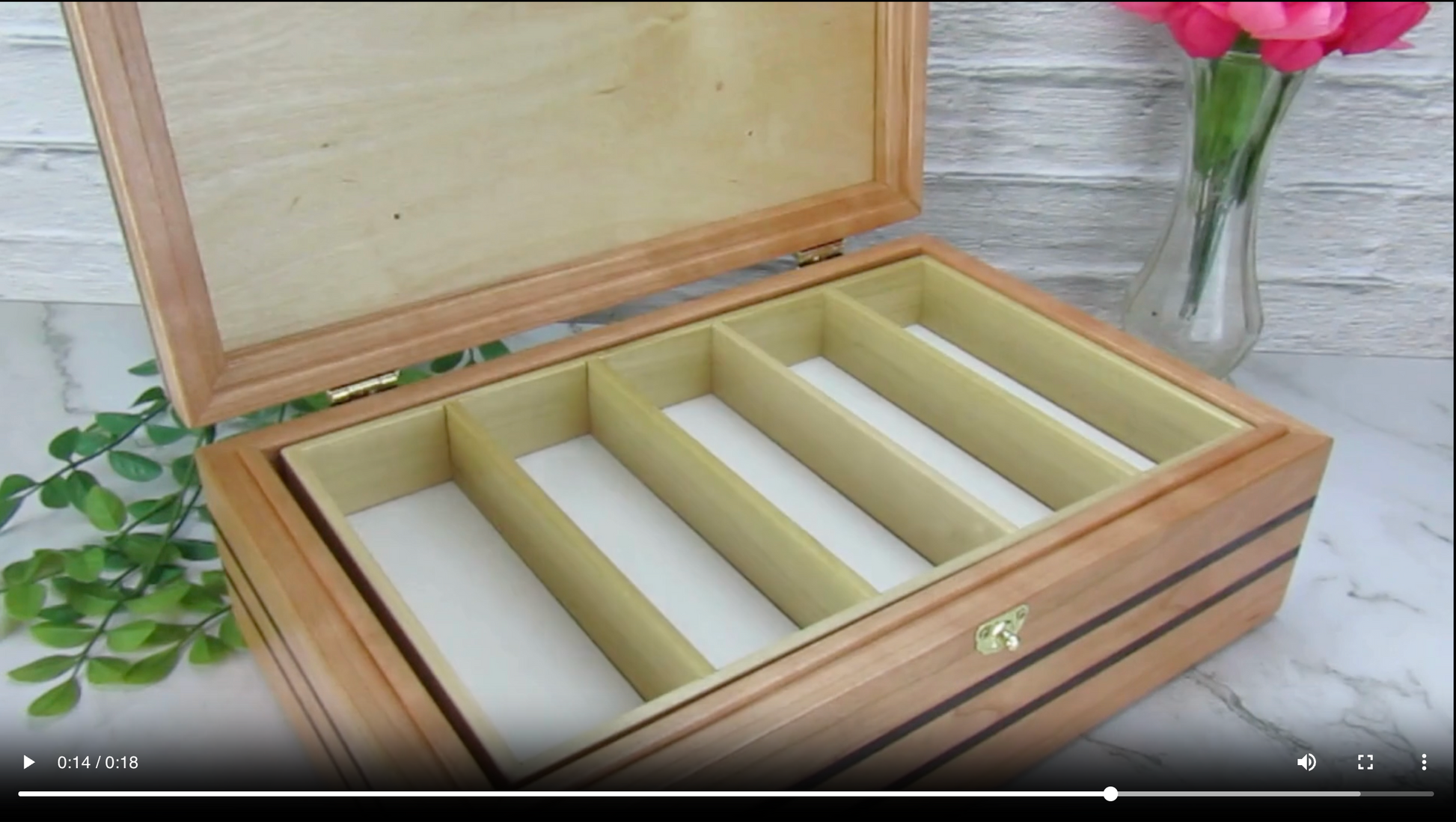 Video showing details of children's memory box with photo lid handmade from cherry and wenge by A Finer Cut Woodworking. 